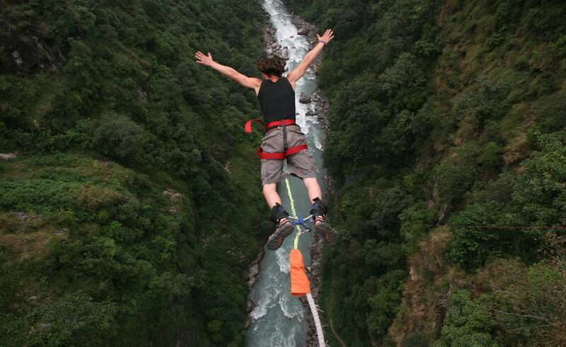 bungee jumper falling from cliff